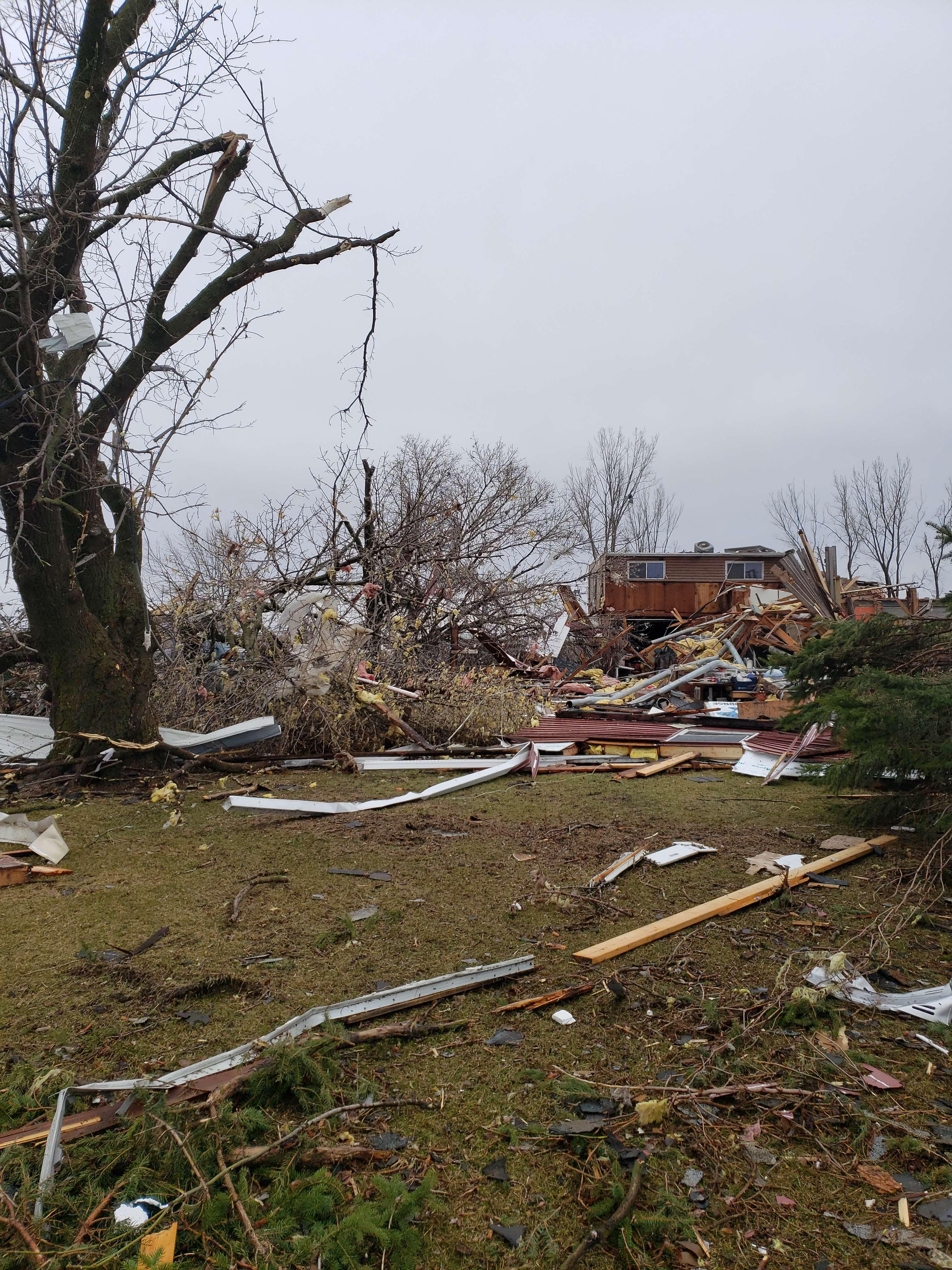 Heavy EF2 damage to a home and trees on the west side of Taopi, Minnesota.
