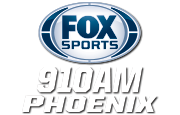The Fox Sports logo, a silver oval with blue trim and the blue letters FOX Sports. Beneath, on two lines in white, are "910 A M" and "Phoenix" in a condensed italicized sans serif.