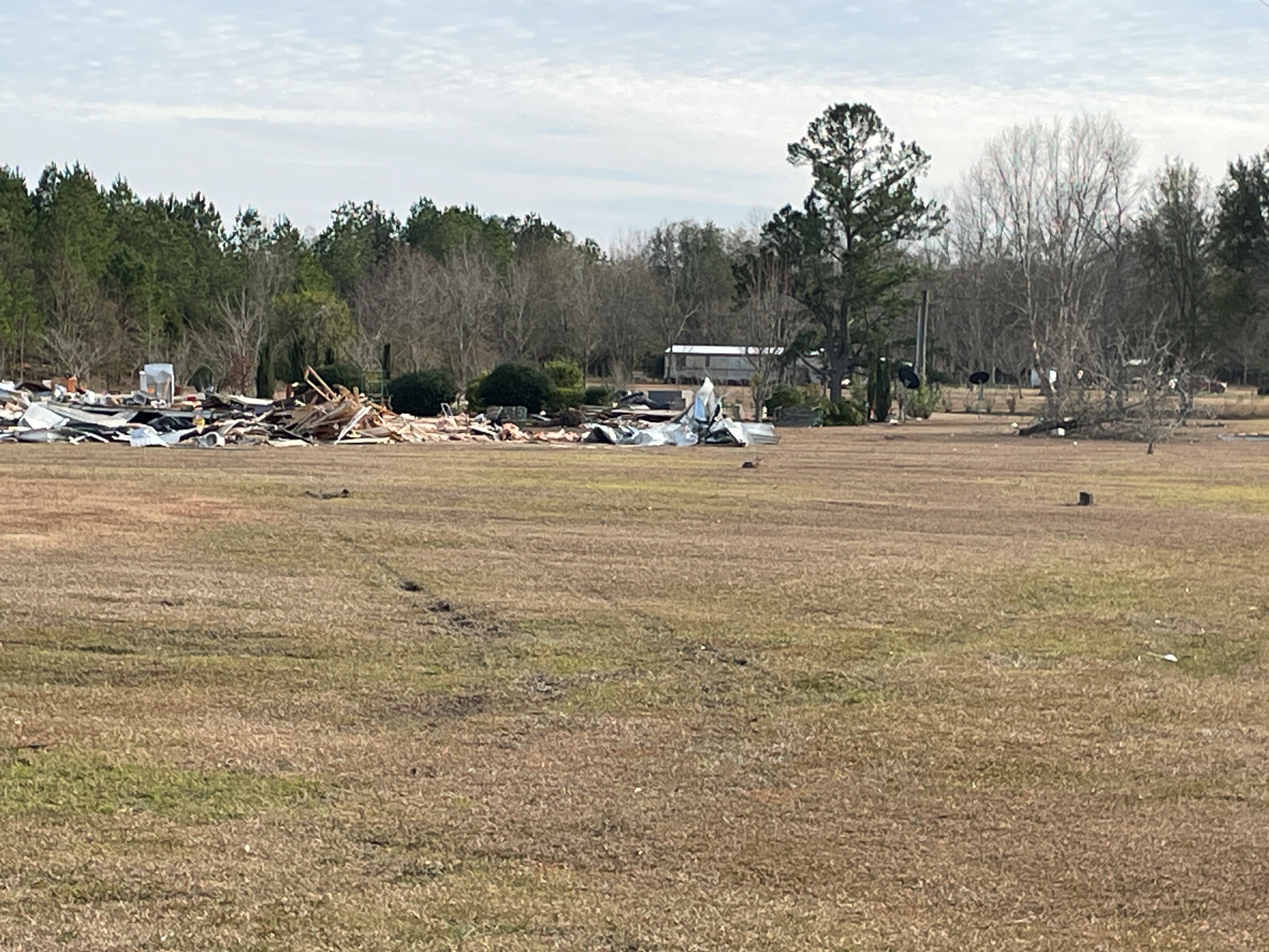 Remnants of a mobile home that was destroyed at high-end EF2 intensity northeast of Cottonwood, Alabama. One person was killed at this location.