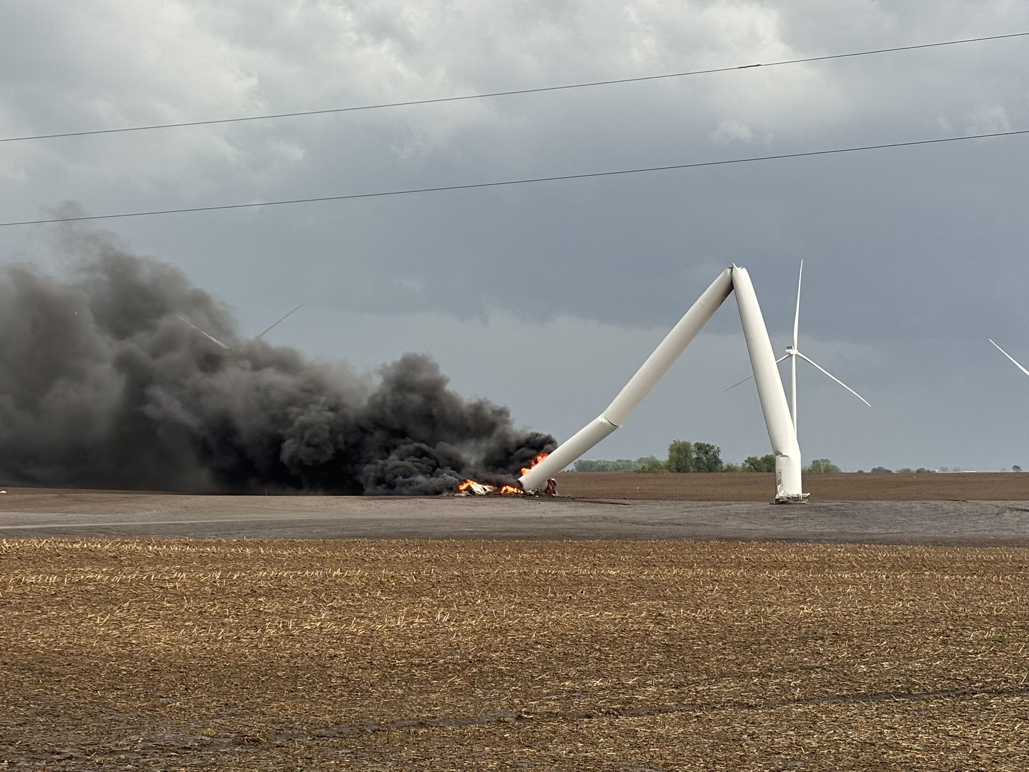 A wind turbine that was knocked down and caught fire northeast of Corning, Iowa after being struck by the Greenfield tornado.