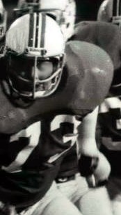 Black and white photo of John Hannah in a Patriots uniform.