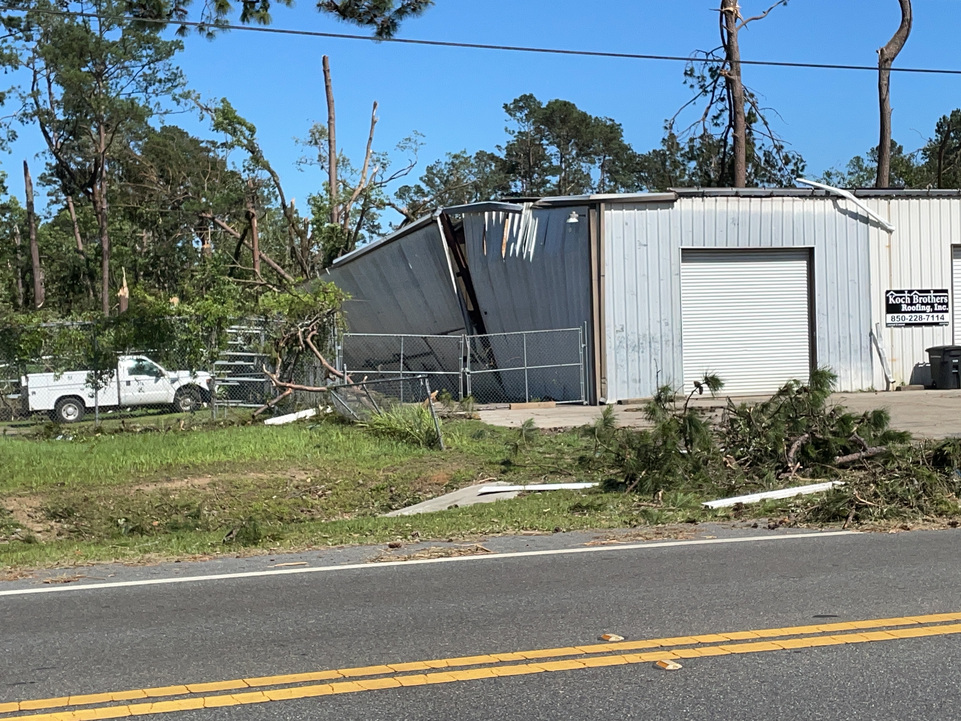 Low-end EF2 damage to an automotive repair building from the 1st Tallahassee tornado.