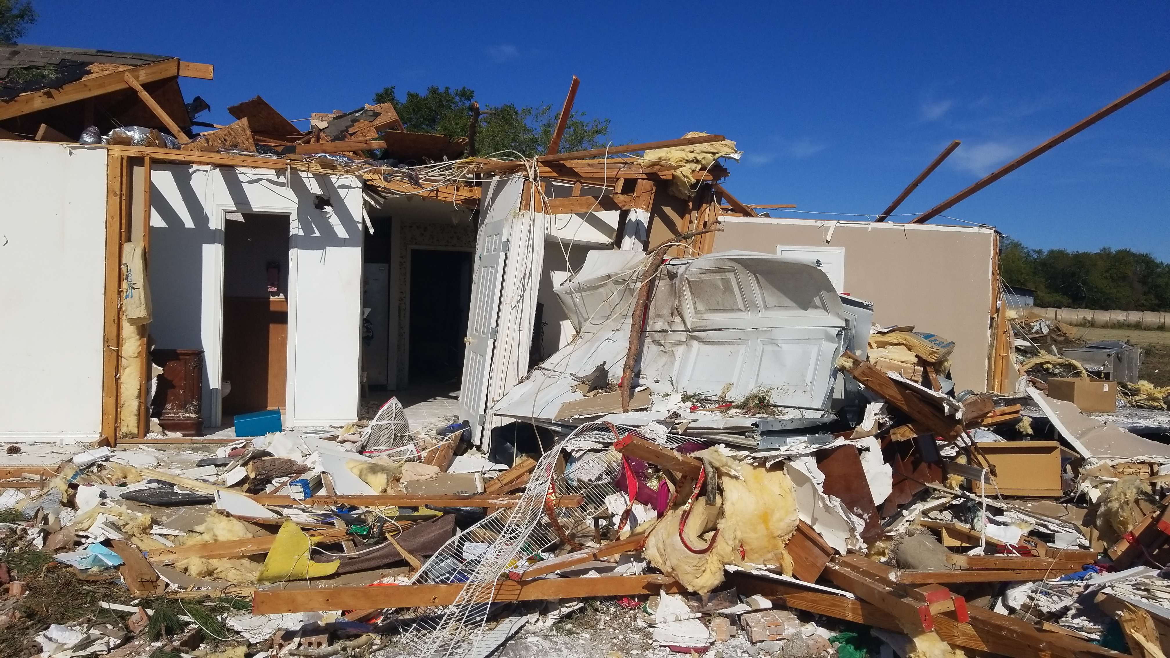 A home that was heavily damaged by an EF2 tornado southwest of Sulphur Springs, Texas.