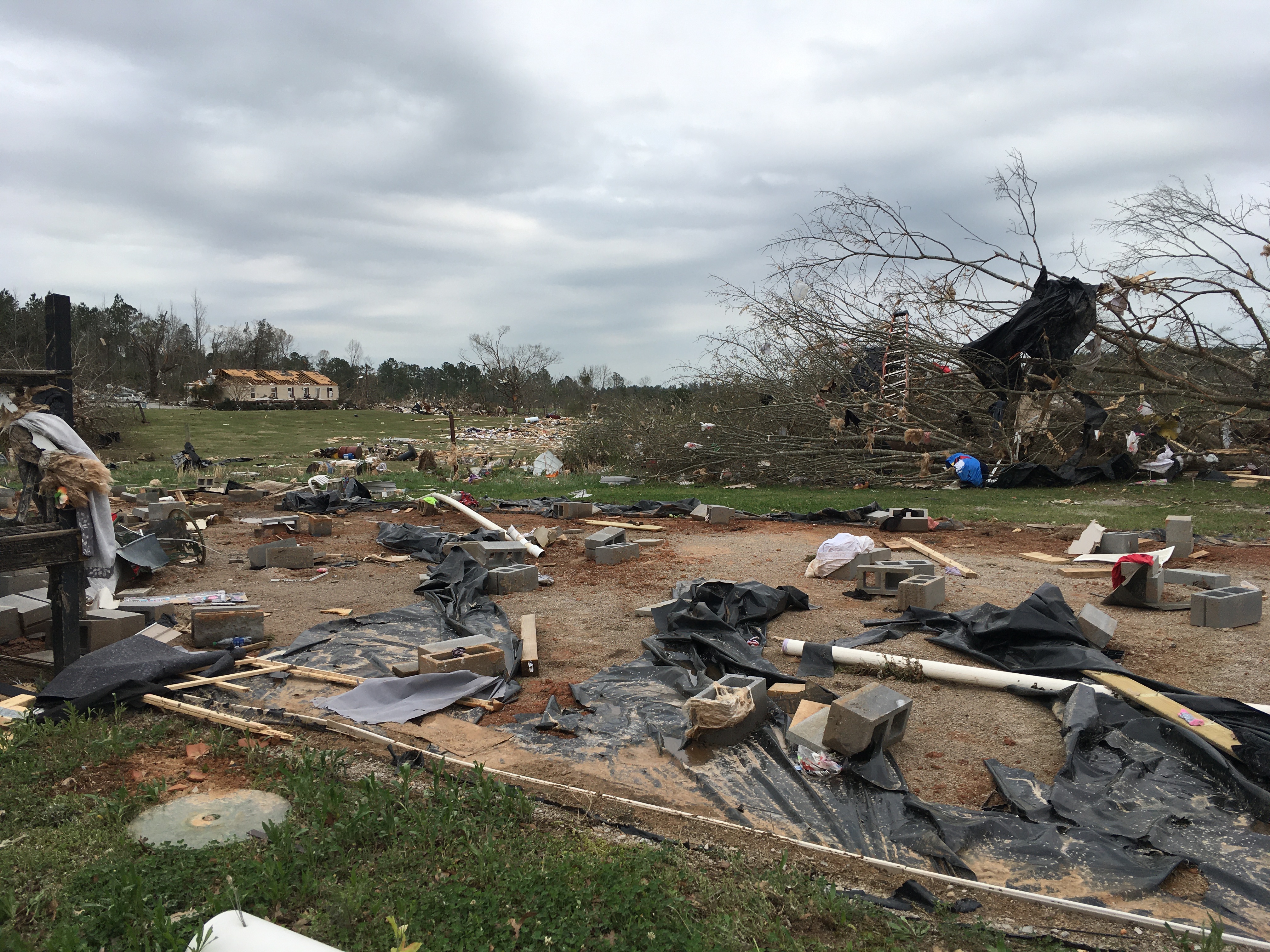 A home that was destroyed at EF2 intensity near Ashby, AL caused by the EF3 Sawyerville tornado. EF1 damage to homes can also be seen.