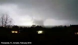 Lightning illuminating the Pensacola tornado.