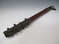 A small antique Japanese wooden club with iron-covered ends and iron studs (ararebō)[3]
