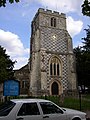 St Nicholas's Church. The tower in perpendicular style with chequered pattern of ashlar stone and cobbles