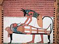 Image 98Anubis, the god associated with mummification and burial rituals, attending to a mummy (from Ancient Egypt)