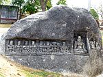 Sculptures of four Hindu deities one on each side of an oblong isolated boulder to the east of the Kauwadol Hill.