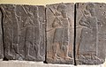 Basalt wall slab showing Assyrian soldiers in procession, holding maces and bows. From the palace of Tiglath-pileser III at Hadatu, Syria. Ancient Orient Museum, Istanbul