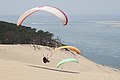Paragliders above the dune