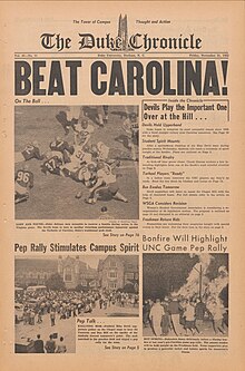 The front page of The Duke Chronicle, featuring the very large headline "BEAT CAROLINA!" and showing photos from the previous year's game including a scramble after a fumble, a pep rally crowd, and a bonfire