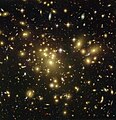 Yellow galaxies belong to the cluster itself. Red and blue are background galaxies gravitationally lensed.
