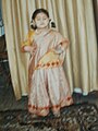 Little Pakistani girl in traditional formal ghagra dress