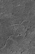 Mars Global Surveyor Mars Orbiter Camera (MOC) image of lava channel on the northeastern summit of Ascraeus Mons.