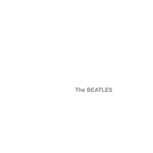 The words "The Beatles" embossed on a plain white background, with a serial number in the lower right.