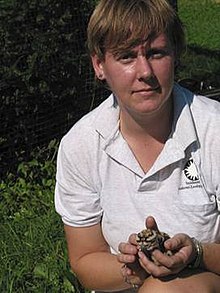 Photo of Sara Hallager holding a small bird