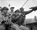 Gen. MacArthur, UN Command CiC (seated), observes the naval shelling of Incheon from the USS Mt. McKinley, 15 September 1950.