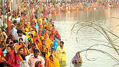 People gathered at a pond in Janakpur, Nepal to worship the god Sun and his consort Chhathi Maiya (2008)