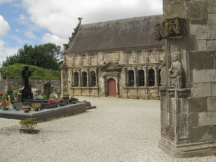 View of the Pencran ossuary with the triangular pediment over the entrance and ionic pillars on either side of each of the six windows