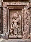 Outer walls include reliefs of Vedic and Puranic deities. Above: Indra.