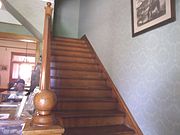 Staircase leading to the second floor of the Manistee Mansion.
