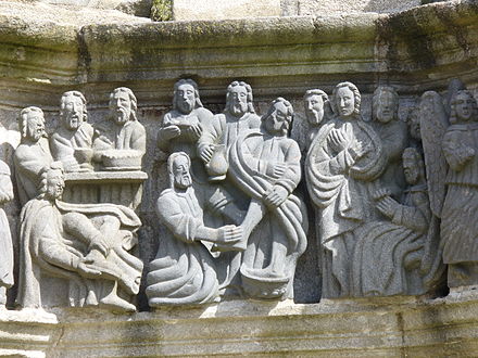 Jesus washing the disciples' feet. Note that the disciple sitting on the far left is taking off his shoes ready to take his turn.[1]