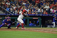 Odubel Herrera follows through on a swing in a game against the New York Mets