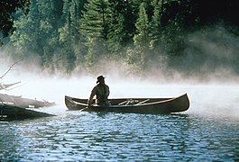 Bill Mason paddling one of his Chestnut canoes.