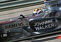 McLaren had no title sponsor in 2006 but the Johnnie Walker logo was used on the side pods, as evidenced by Juan Pablo Montoya's McLaren MP4-21 at the 2006 United States Grand Prix. From this year onwards, the team has also used a highly reflective version of its silver livery.