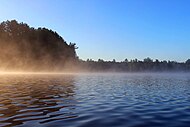 Morning mist on Brantingham Lake, Adirondack Mountains, New York. Photo by pstark1.