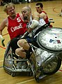 Wheelchair rugby players use wheelchairs with strong frames, foot protection and wheel covers, to prevent injury in this contact sport.