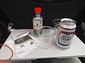 Molson Canadian beer can with pretzels on an Air Canada tray table in 2017