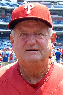 A man in a red shirt and cap