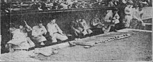 A baseball dugout with players in it