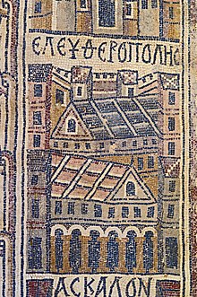 A mosaic showing two buildings within walls. It is labelled ΕΛΕΥΘΕΡΟΠΟΛΙϹ.