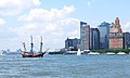 Image 6A historical juxtaposition: a replica of Henry Hudson's 17th-century Halve Maen passes modern-day lower Manhattan where the original ship would have sailed while investigating New York Harbor. (from History of New York (state))