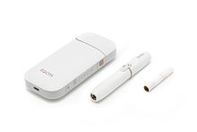 IQOS, consisting of a charger, holder, and tobacco stick.