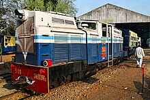 Blue and white articulated diesel locomotive