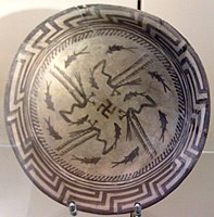 The Samarra bowl, at the Pergamonmuseum, Berlin. The swastika in the centre of the design is a reconstruction.[75]