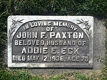 Flat stone marker engraved with Paxton's name