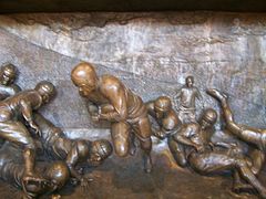 Relief of Nile Kinnick's famous touchdown against the University of Notre Dame in south end of the stadium