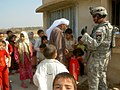 3PLT hands out candy on a patrol in Iraq, 14 February 2007.