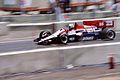 Andrea de Cesaris drives the JS23 chassis at the 1984 Dallas Grand Prix.