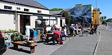 Cliffoney Country Market takes place in the village hall twice each month. The mural on the gable of O'Donnell's Bar was painted in 2015.