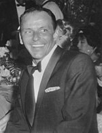 Black and white photo of Frank Sinatra at Girl's Town Ball in Florida (1960).