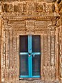The intricately carved, panchasakha sanctum door of the Surya shrine; the lalita-bimba shows Surya