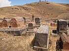 Cemetery below Didi Kond Hill with the shrine of Surb Grigor in the background
