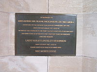 Plaque at Cabaret Rouge gives details about Frank Higginson the architect of the cemetery.