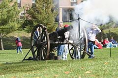 Procured by the senior class of 1903 as its graduation gift to the institution, Monmouth College's Civil War-era cannon spent 50 years at the bottom of a creek after having been stolen by the rival junior class. Today the restored weapon, which is technically an artillery rifle, signals Monmouth College touchdowns in the annual Homecoming football game.